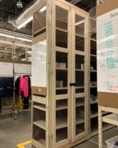 Custom wood and mesh security cage in a Nordstrom stockroom